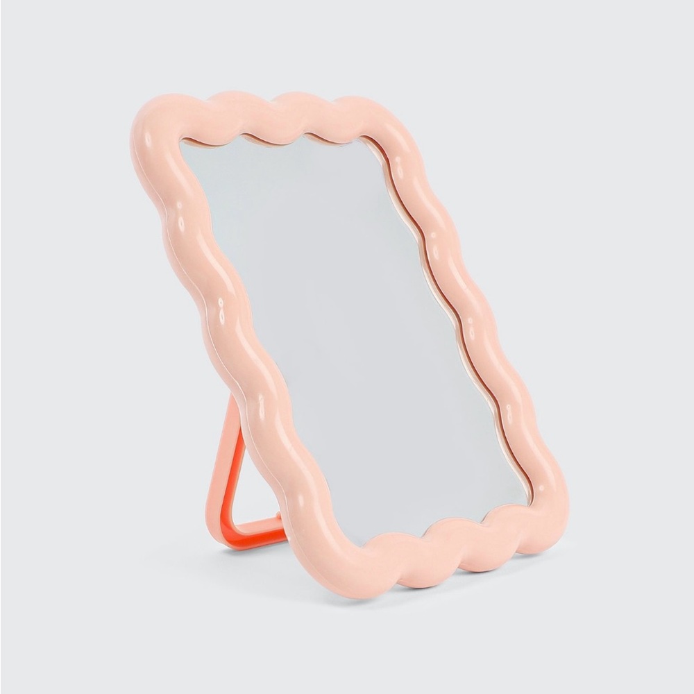 Wavy framed mirror with stand